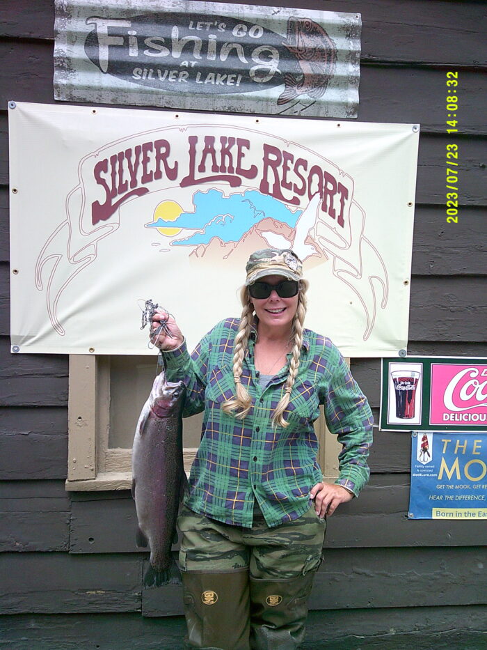 Julie Costello with a nice 7 pound 9 oz Rainbow caught on the shore of Silver Lake using Berkley Power Bait